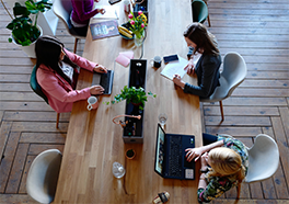 co-working people at desk